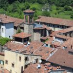 Vista del borgo piemontese con dimore storiche, ideale per soggiorni economici ad aprile.